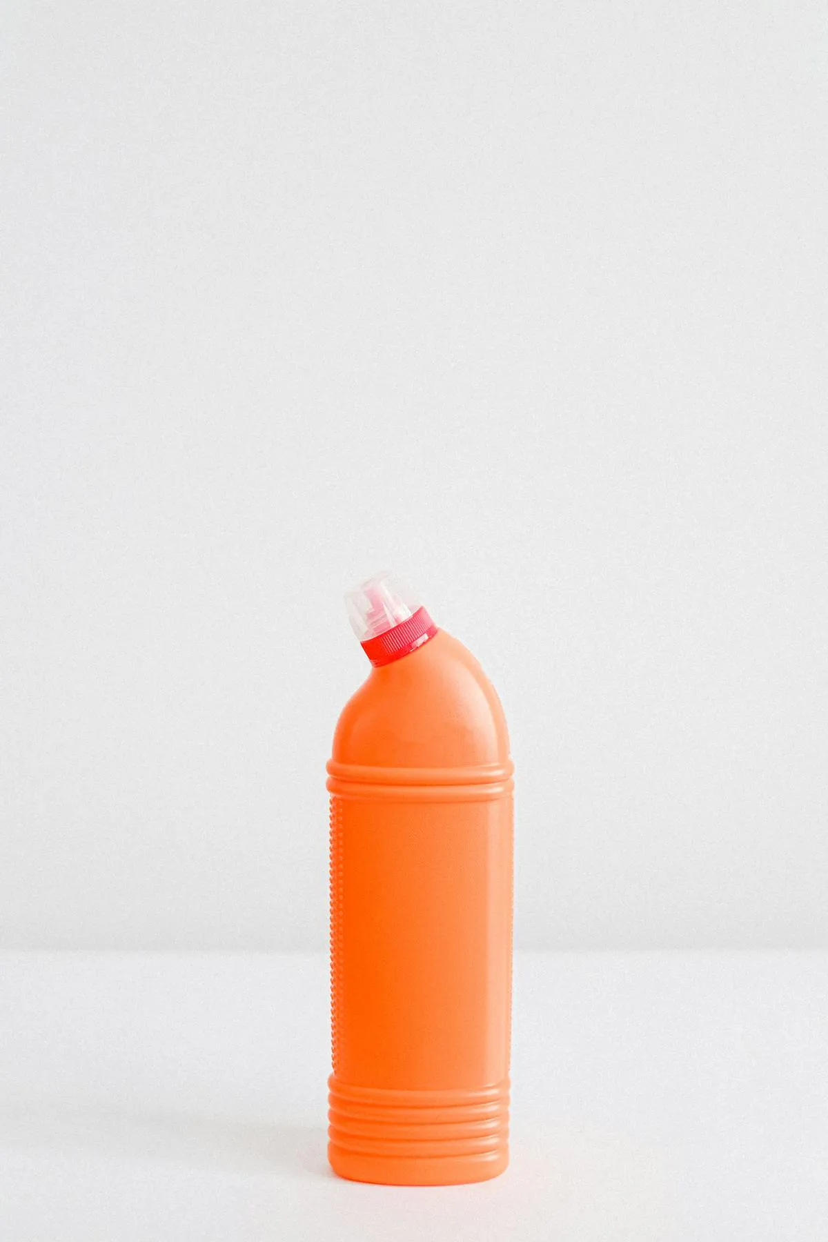 Professional mixing house wash chemicals with proper PPE and measuring containers