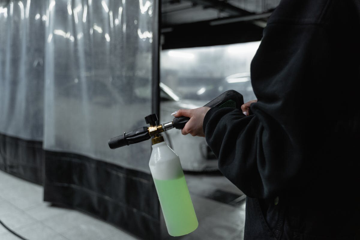 Close-up of a downstream chemical injector mounted on pressure washing equipment