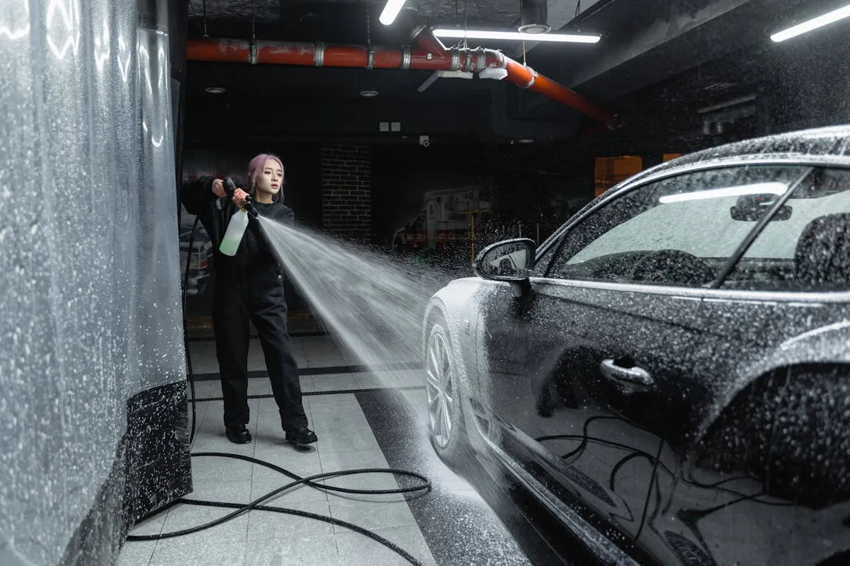 Pressure washer pulsing with inconsistent water spray pattern visible