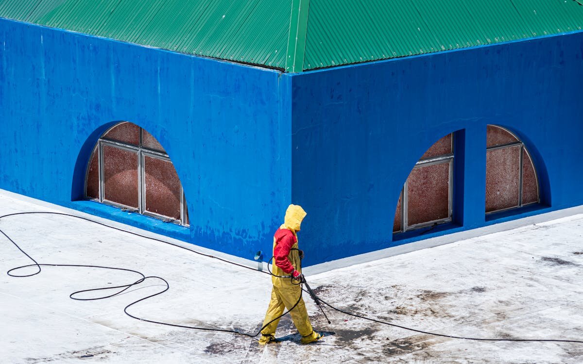 Pressure washing equipment properly stored for winter with covers and organization