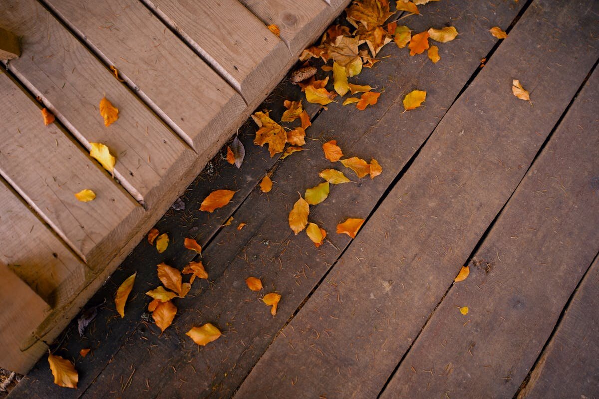 Properly pressure washed wood deck showing clean, grain-raised surface ready for sealing