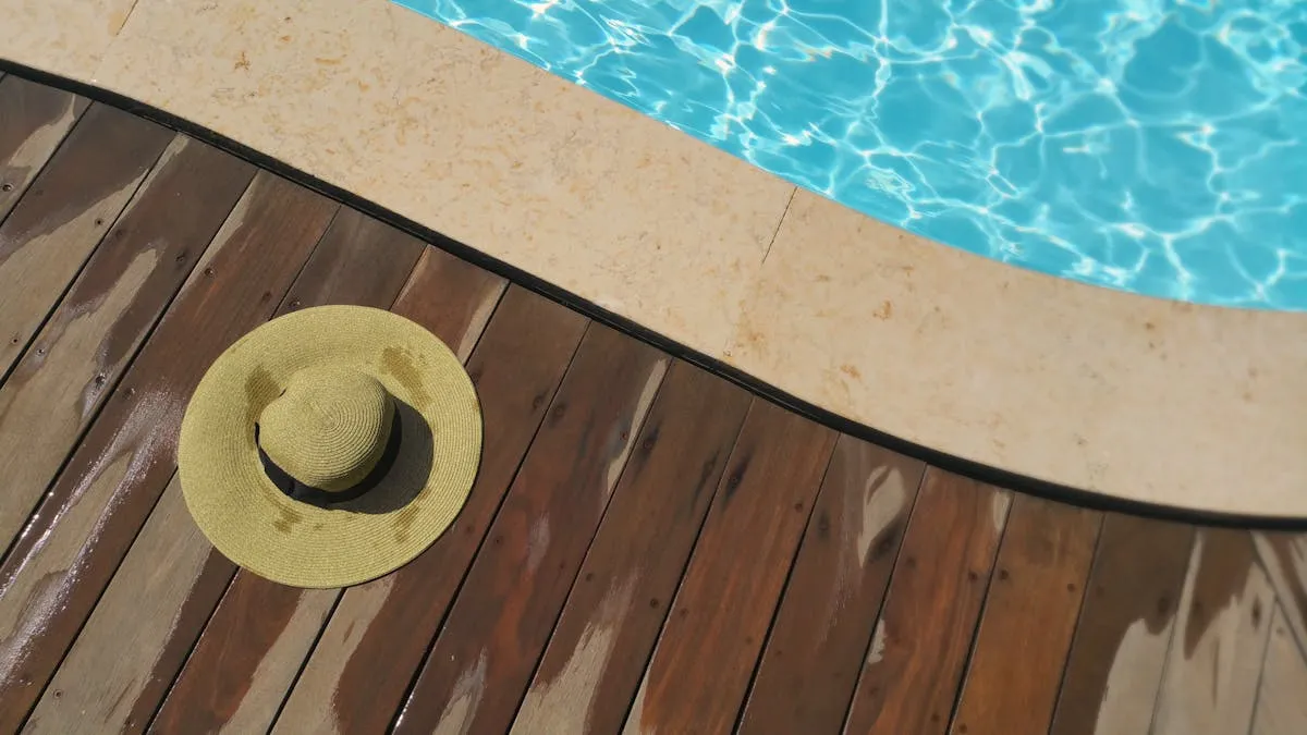 Pressure washing a concrete pool deck with proper drainage and safety precautions