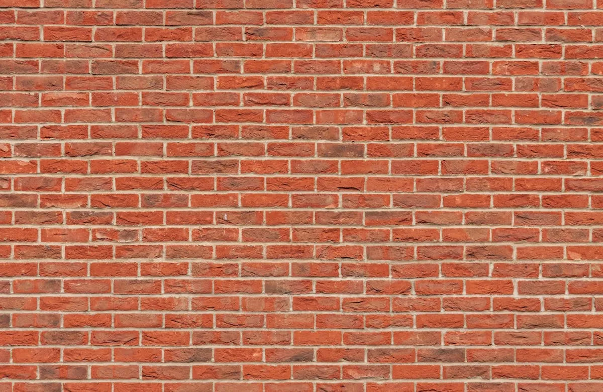 Pressure washing brick exterior with proper mortar-safe technique