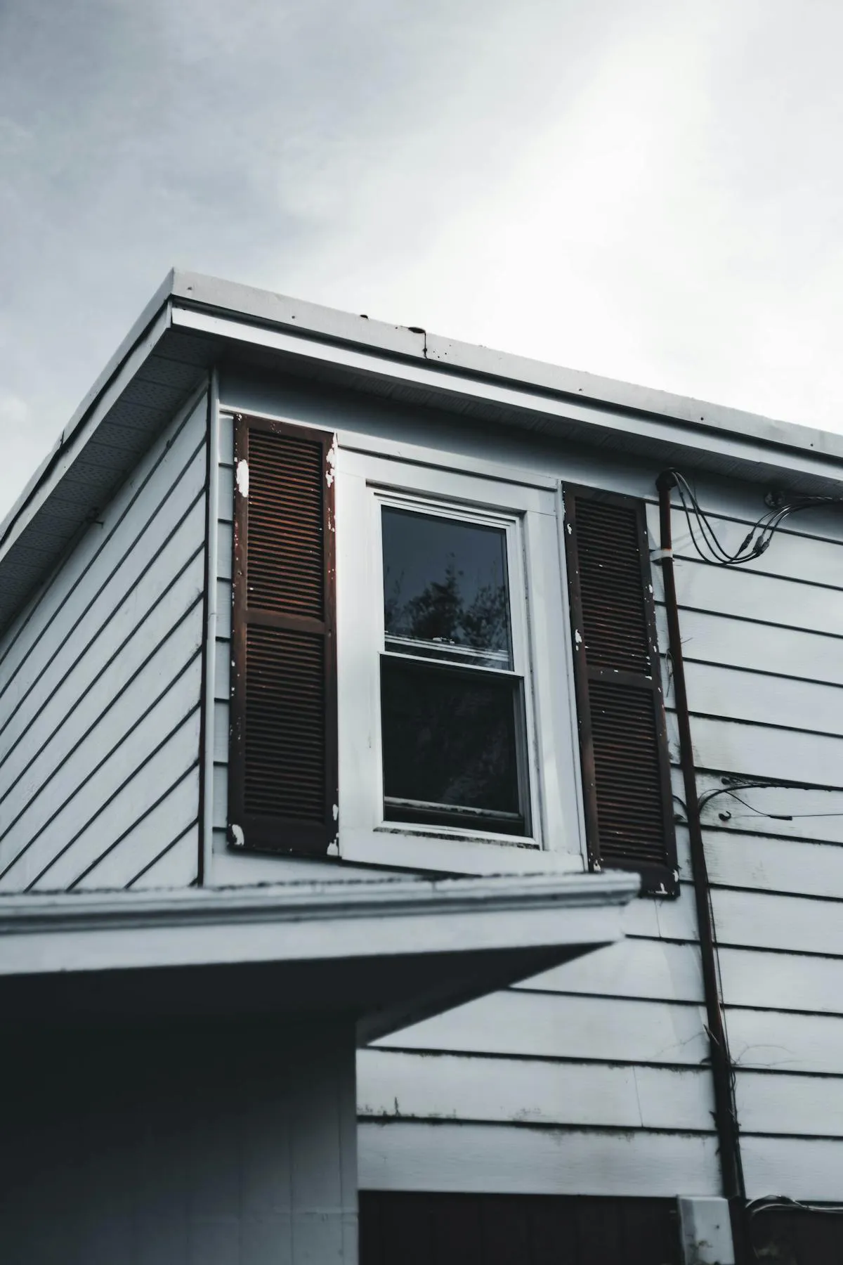 Pressure washing a two-story house with extension wand