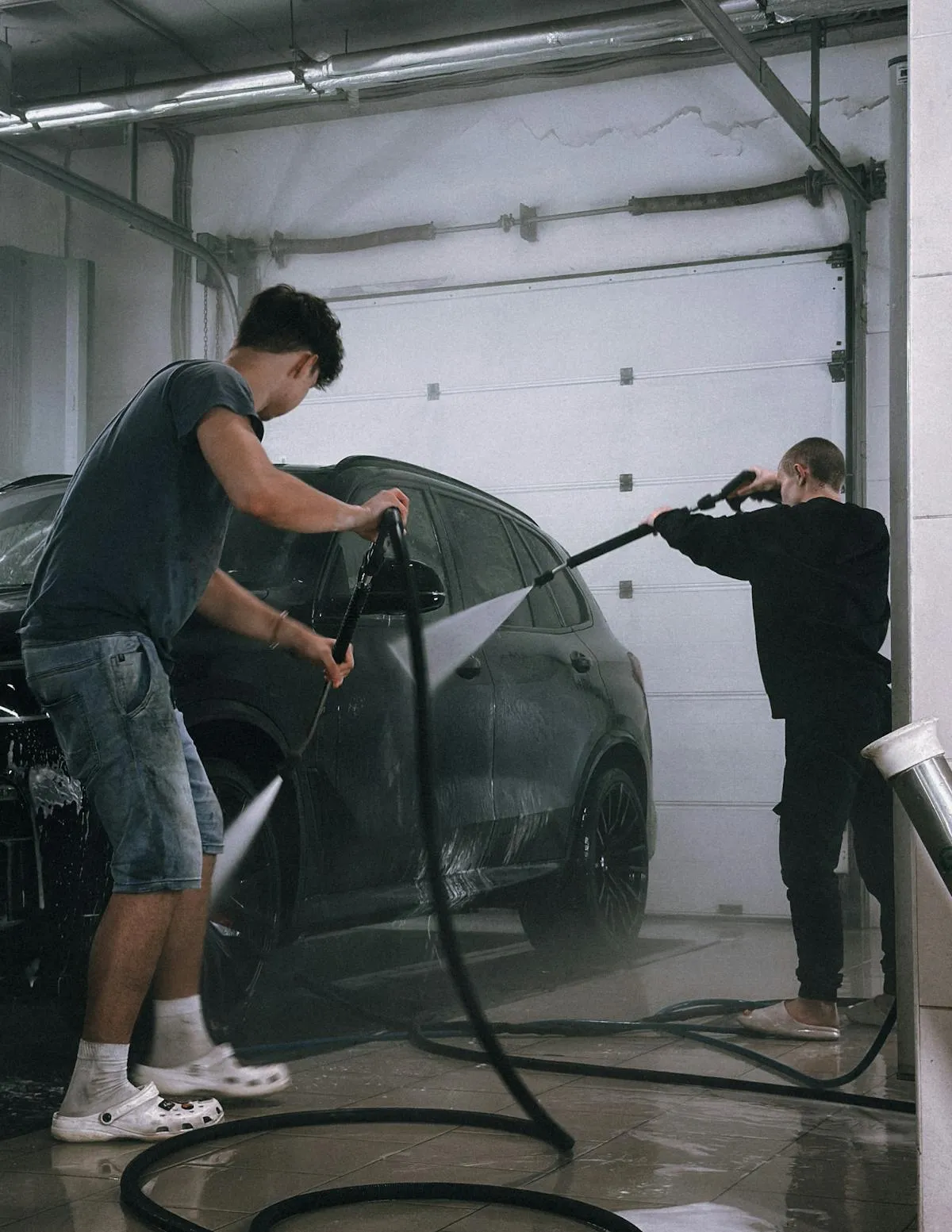 Pressure washing a driveway in bright sunlight with proper technique
